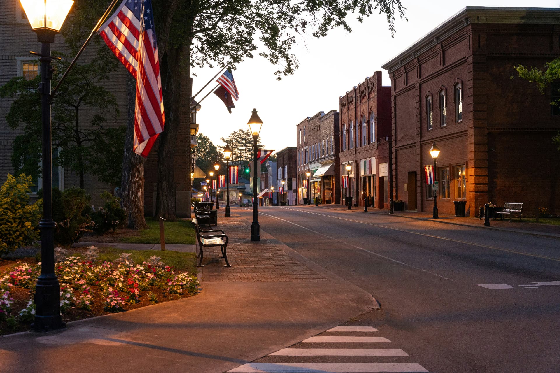 A main street of small shops at dusk
